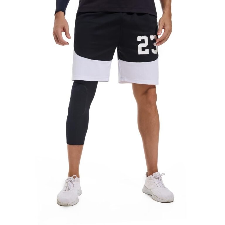 Man in athletic wear, black shorts with number 23, knee brace, and sneakers