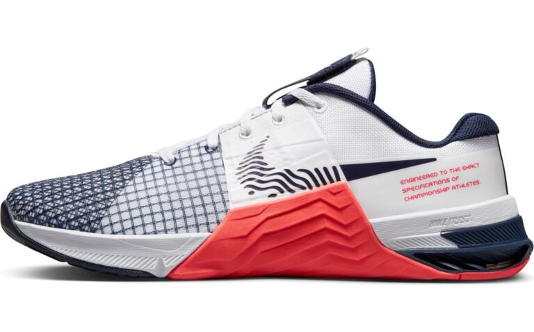 White, blue, and red Nike Metcon athletic shoe, side view