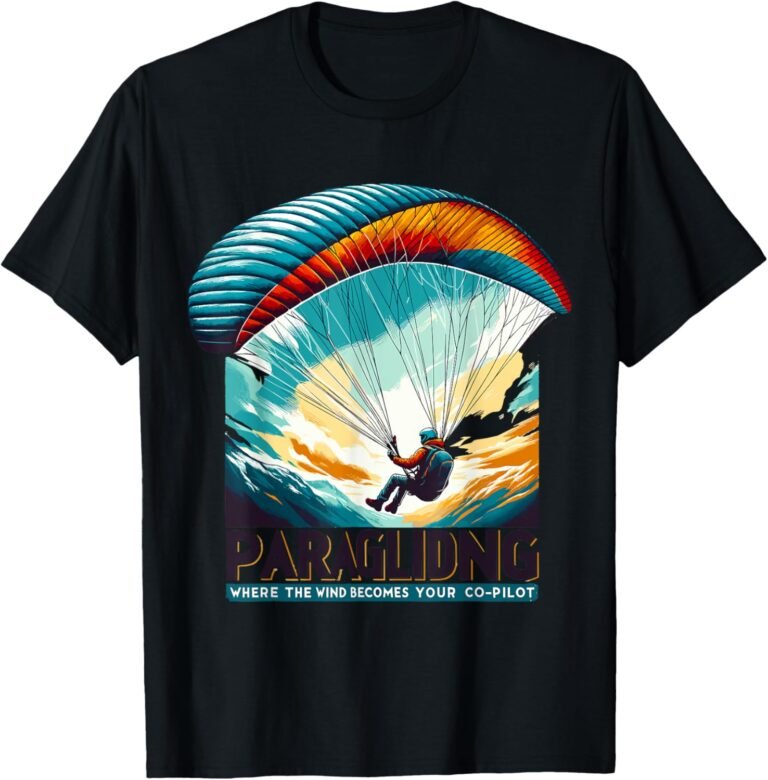 Paraglider soaring over mountains with colorful parachute, on a black t-shirt